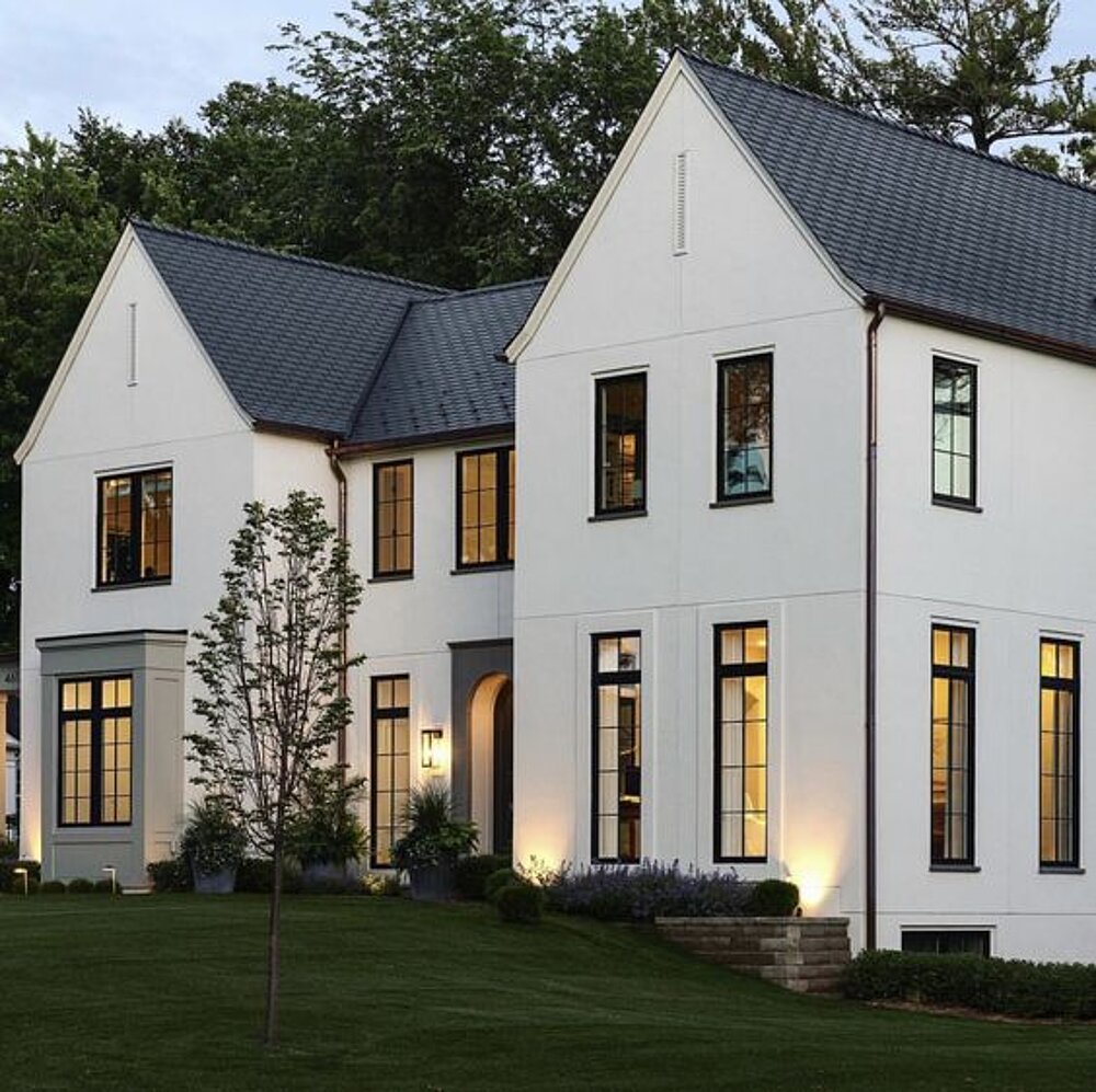 Single-family residence with a pitched roof and expansive glazed surfaces