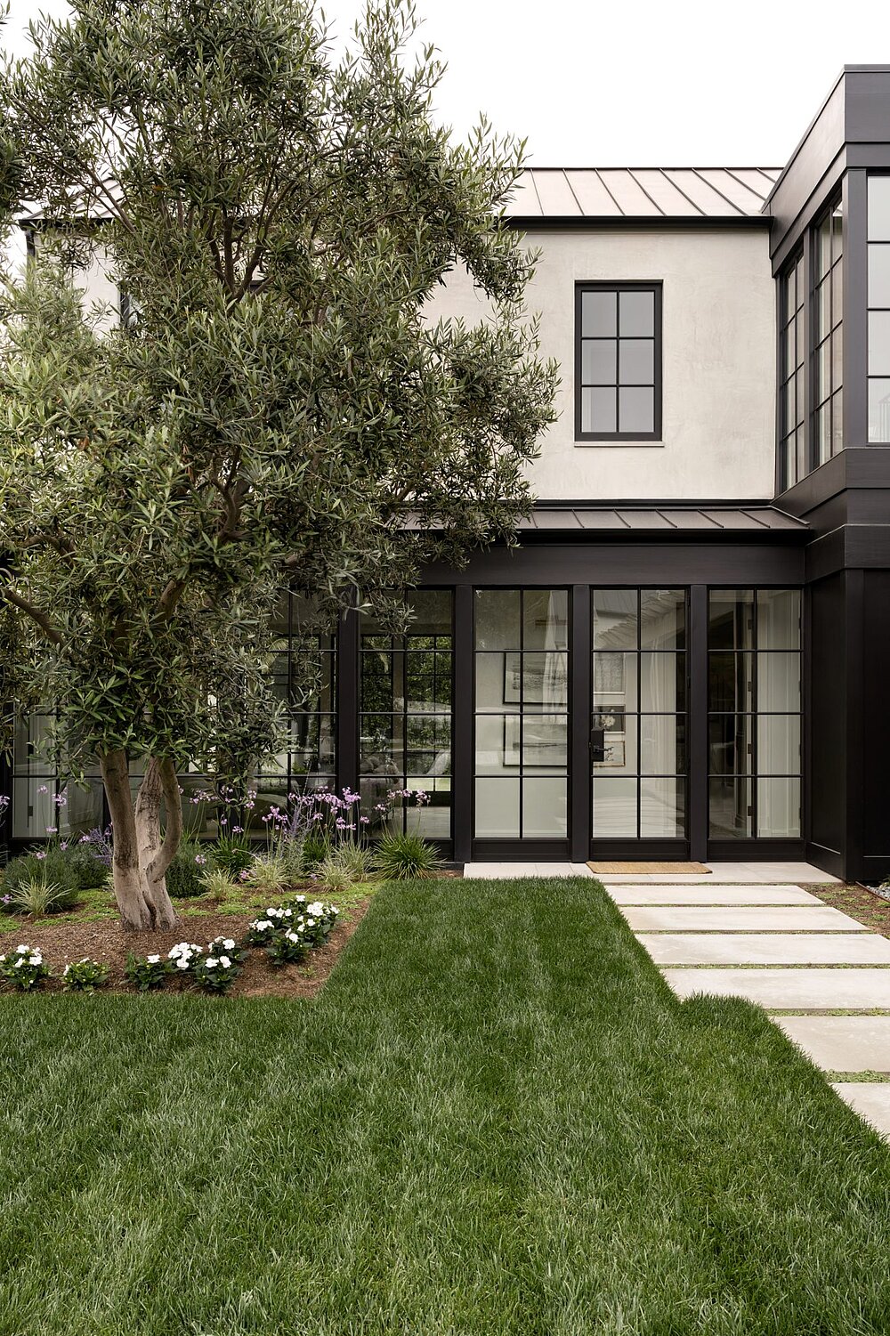 House with front garden, steps, and a covered entrance