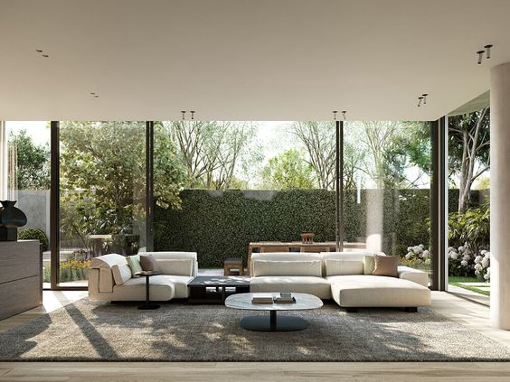 Open-plan living area with floor-to-ceiling glazing and views of the garden