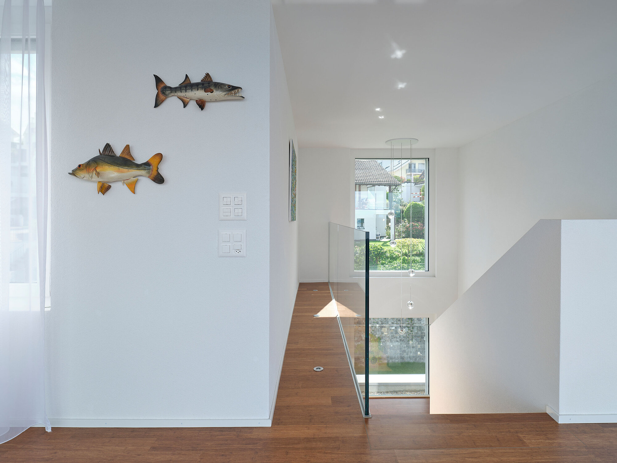 [Translate to English:] Das Einfamilienhaus COAST in der Innenansicht, Treppe