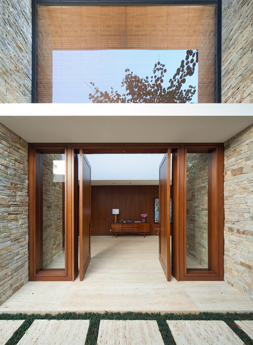 Entrance area with large timber-framed doors